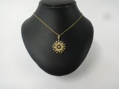 An antique diamond and pearl star pendant set in yellow gold, diameter 26mm.