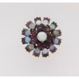 An antique high set ruby and opal cluster ring, size S.