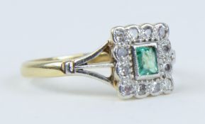 An 18ct emerald and diamond square set ring, size M.