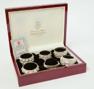 A cased set of six Oman sterling silver bangle design napkin rings, stamped 'OMAN 925'.