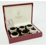 A cased set of six Oman sterling silver bangle design napkin rings, stamped 'OMAN 925'.