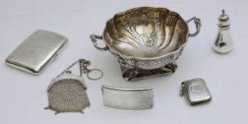 A mixed lot of silver items including card case, pepper pot, vesta, ash tray, cigarette case, (9.