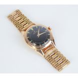Zenith, a gents 18ct gold automatic wristwatch, marked '18k', with black dial and gilt batons,