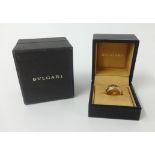 Bvlgari, an 18ct gold band ring, size M, approx 13gms, with box and outer box.