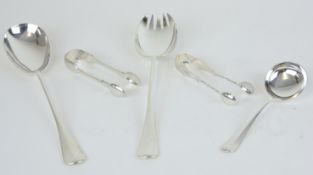 A pair of silver servers with rat tail bowls, two pairs of sugar tongs and a caddy spoon with