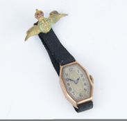 A 9ct vintage ladies wristwatch and a RAF brooch.