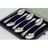 A set of six Victorian silver teaspoons with bright cut decoration, cased.