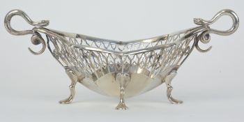 A silver and pierced bon bon dish marked 'RMEH' with snake scroll handles, approx 5.15oz.