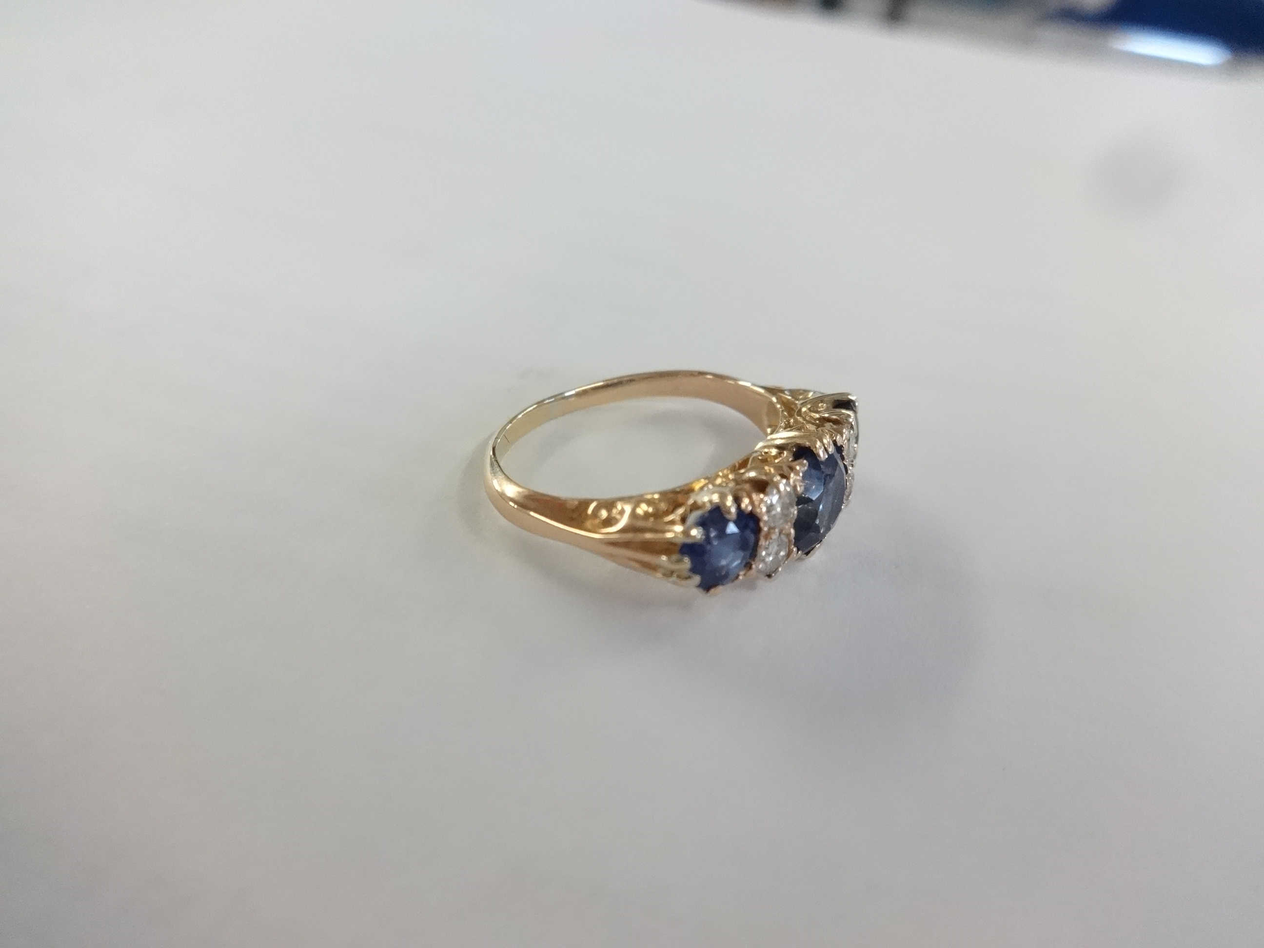 A sapphire and diamond ring set in yellow gold, unmarked, size K. - Image 4 of 5