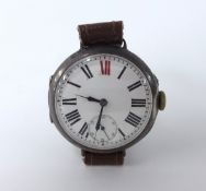 A silver cased trench watch with roman numerals and red twelve and sub second dial.