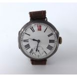 A silver cased trench watch with roman numerals and red twelve and sub second dial.