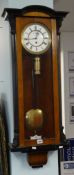 A Vienna style mahogany case wall clock with single weight and pendulum.