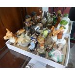 A collection of various ornaments including Hummel, Beswick, porcelain pincushion head etc.