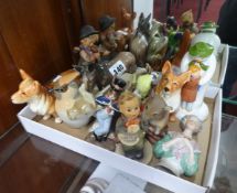 A collection of various ornaments including Hummel, Beswick, porcelain pincushion head etc.