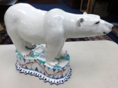 Modern pottery group of a polar bear indistinctly signed, height 24cm.