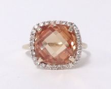 A 9ct citrine and diamond cluster ring.