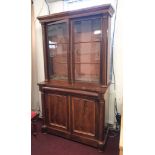 A Victorian mahogany two part library bookcase, height 200cm and width 112cm.