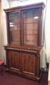 A Victorian mahogany two part library bookcase, height 200cm and width 112cm.