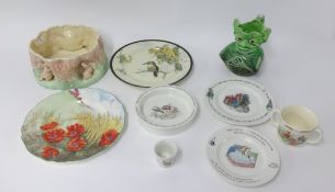 A Sylvac rabbit bowl impressed marks, two Doulton plates decorated with poppies D6312 and another, a