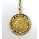 A Geo V gold half sovereign set in a mount on a fine 9ct gold chain, total weight 9.1gms.