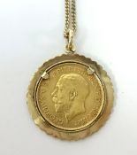 A Geo V gold half sovereign set in a mount on a fine 9ct gold chain, total weight 9.1gms.