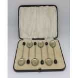 A set six silver and enamelled 'coffee bean' spoons, cased.