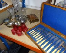 A set of six cranberry glass custard cups, a cased silver plated fish service (lacks one piece),