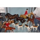 A Beswick horse, foal, fox and four hounds together with two Beswick type hunt horses and a single