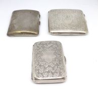 Three silver cigarette cases.