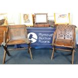 A 19th century carved oak Glastonbury chair with latin inscription.