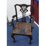 A child's Chippendale style mahogany corner chair.