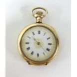A gilt open faced fob watch, back plate marked 'Star', keyless movement, enamelled and gilt dial