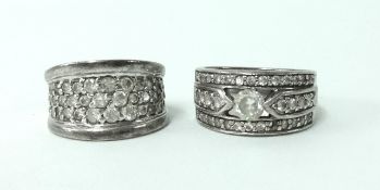 Two contemporary silver dress rings.