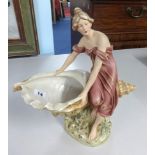 Royal Dux, an Austrian porcelain figure of a lady carrying a conch shell, height 33cm.
