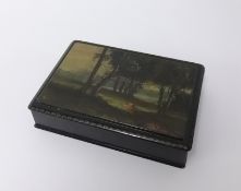 A black lacquered box, lid decorated with woodland landscape scene, indistinctly signed, possibly