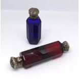 A ruby cut glass double end scent bottle with silver tops and Victorian blue scent glass with silver