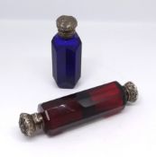 A ruby cut glass double end scent bottle with silver tops and Victorian blue scent glass with silver