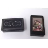 A lacquered box set with a porcelain panel depicting a romantic couple together with a 19th