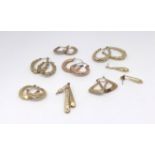 Eight pairs of 9ct earrings, approx 11.5g.