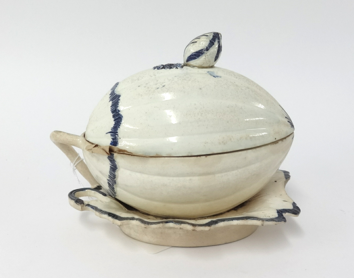 A 19th century Staffordshire pottery tureen modelled in the form of a melon on a leaf, no marks,