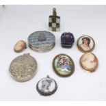 A collection including a silver oval locket, some cameos, H.M.S Damae compact, brooches and scent