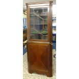 A Georgian mahogany and inlaid two part free standing corner cabinet.
