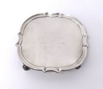 A Geo V silver waiter with inscription 'Lloyds Bank 1932' on four curl feet, diameter 15cm, approx