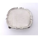 A Geo V silver waiter with inscription 'Lloyds Bank 1932' on four curl feet, diameter 15cm, approx