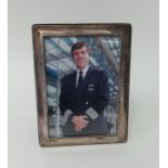 A silver rectangular photo frame, 21cm x 16cm.
