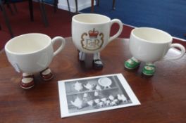 Three Carlton ware lustre design 'walking cups' including QEII.