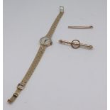 Rone, a ladies 9ct wristwatch, approx 21.30g, a 15ct brooch, 3.30g and a 9ct tie pin.