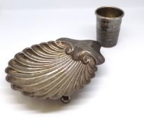 A silver scallop shape butter dish and a novelty oversized thimble.