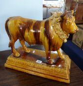 A Portuguese majolica 'decanter' figure of a bull, by Mafra, Caldas de Rainha, decorated in