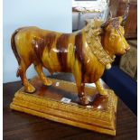 A Portuguese majolica 'decanter' figure of a bull, by Mafra, Caldas de Rainha, decorated in